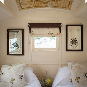 Twin beds in the Showman's Waggon at Beili Glas, Monmouthshire, Wales 