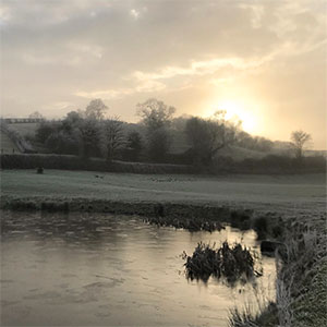Swimming pond in winter at Beili Glas, Monmouthshire, Wales